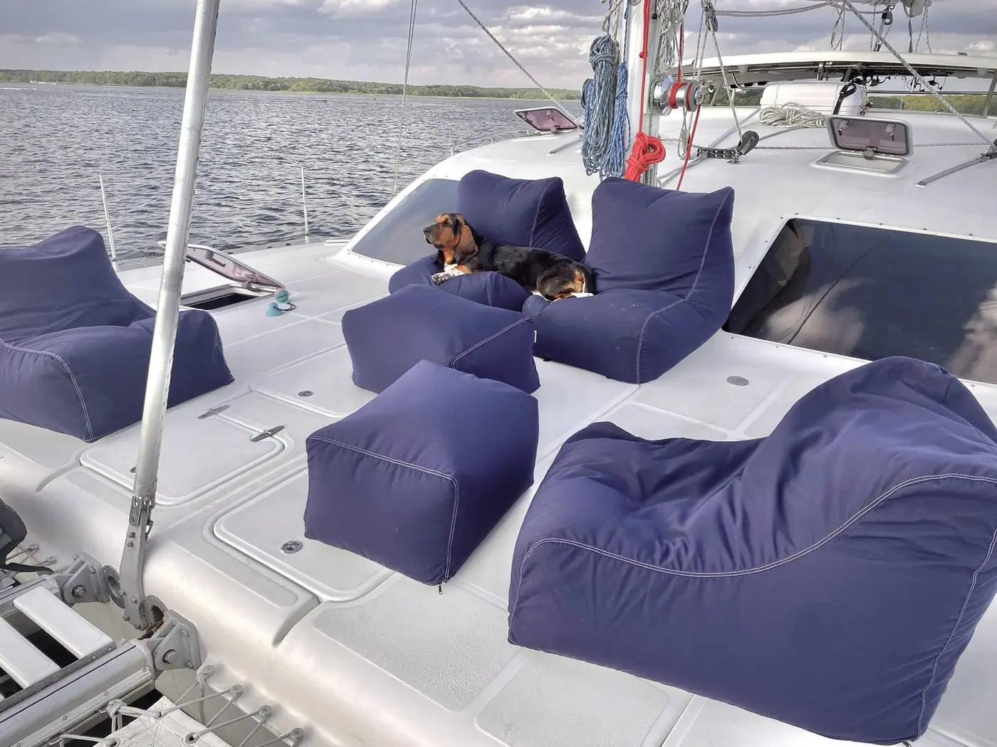 Magic Bus Catamaran on water with sails down