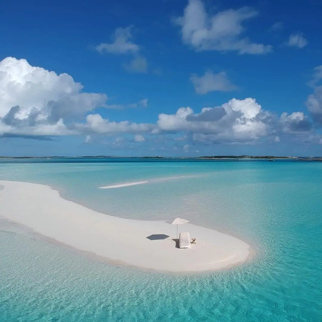 Sandbar stretching into clear blue water in the Exumas