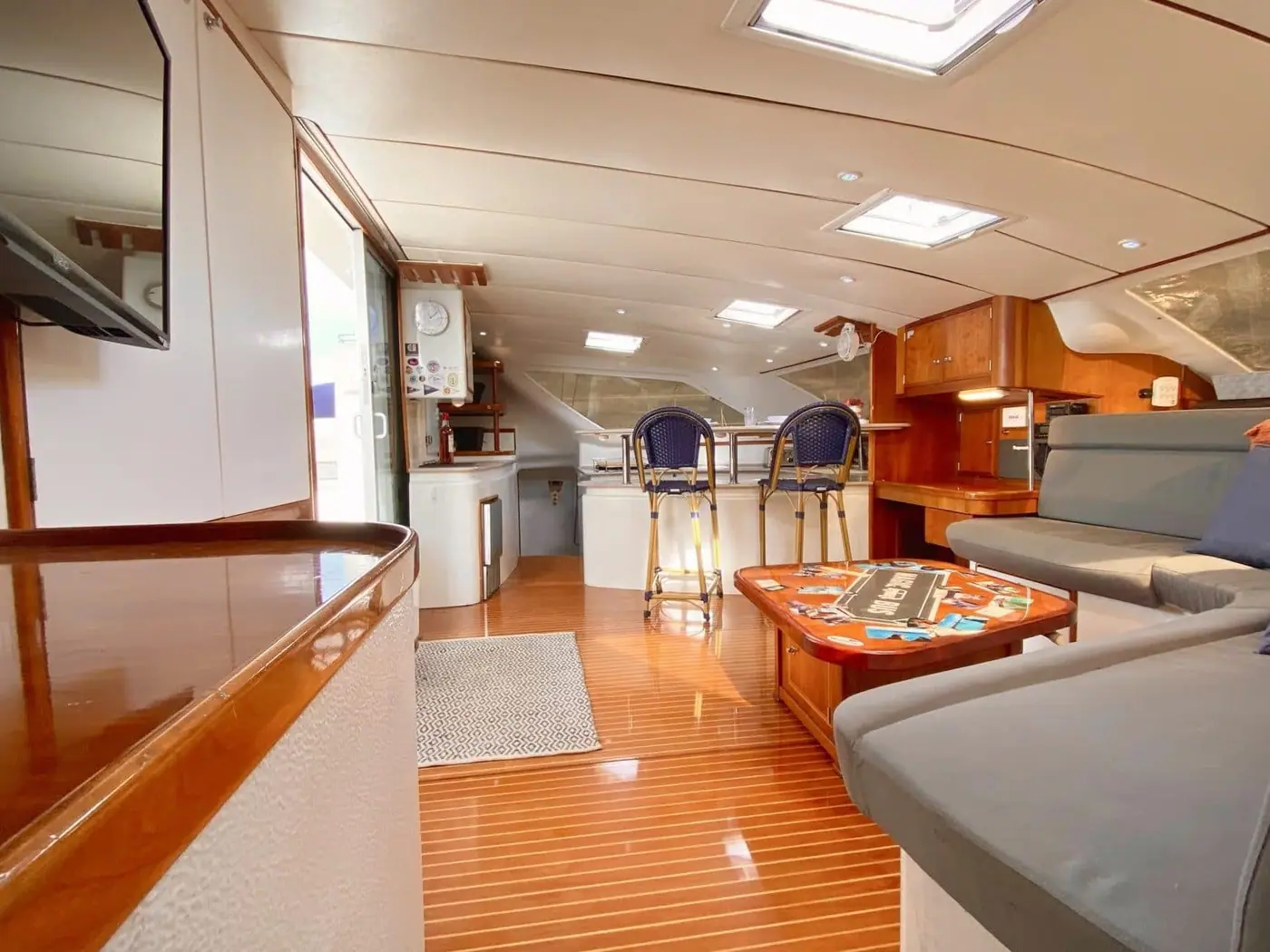 Interior salon of the Magic Bus with wraparound settee and dining table