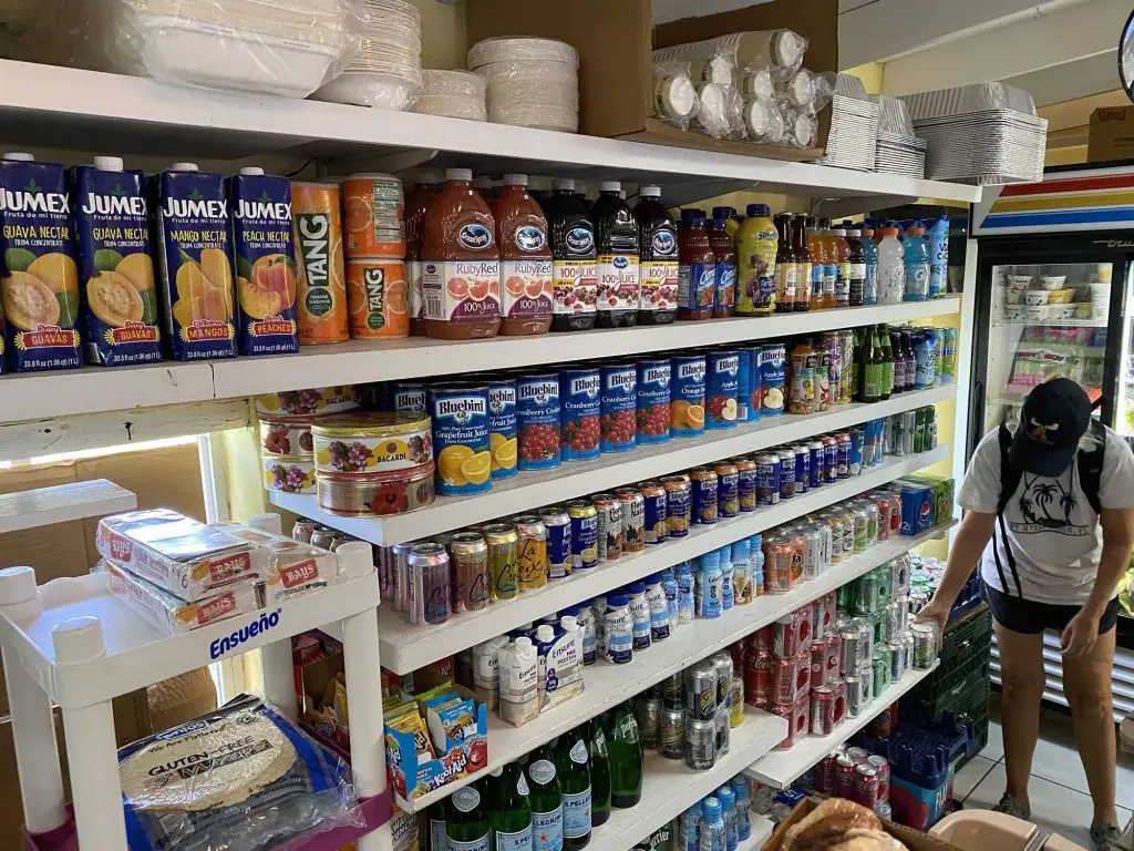 Interior of the local Staniel Cay store showing several stocked aisles.